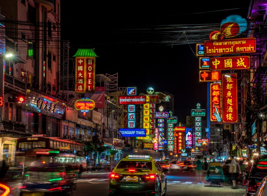 Night scene of ChinaTown in Bangkok illuminated with red and amber lights