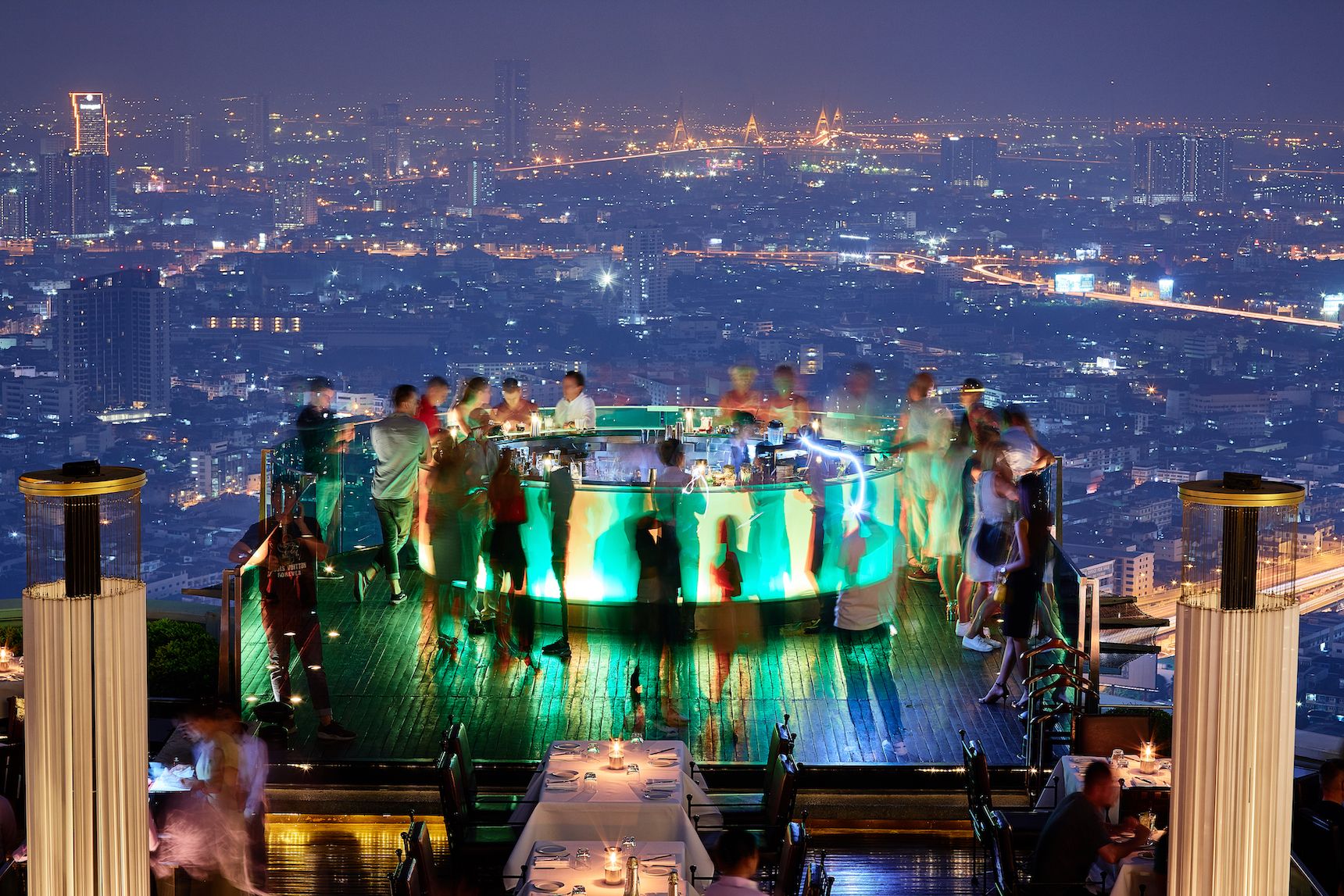 Watch Bangkok Skyline from a roof top bar 