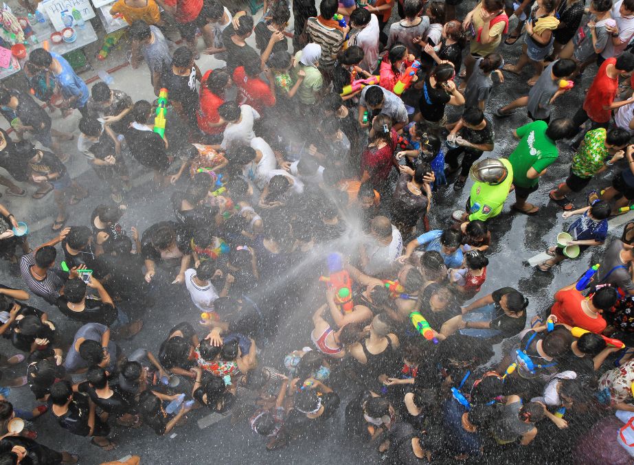 People celebrating Thai new Year Songkran with water on the street of Bangkok