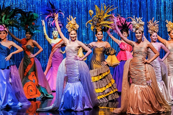 Thai transgender artists dressed in vibrant gowns and headpieces at Calypso cabaret in Bangkok